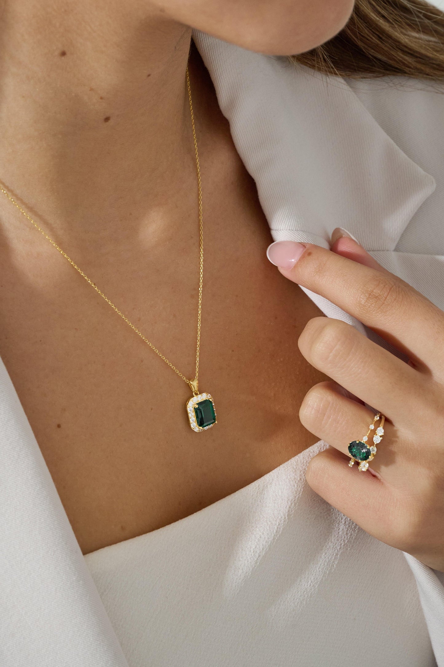 Emerald green necklace with cubic zirconia border on 18K Gold vermeil necklace paired with Emerald green oval ring a half eternity cubic zirconia ring