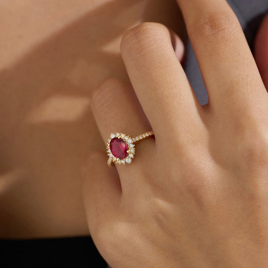 Ruby red gemstone with cubic zirconia halo and pave band on 18K gold vermeil.