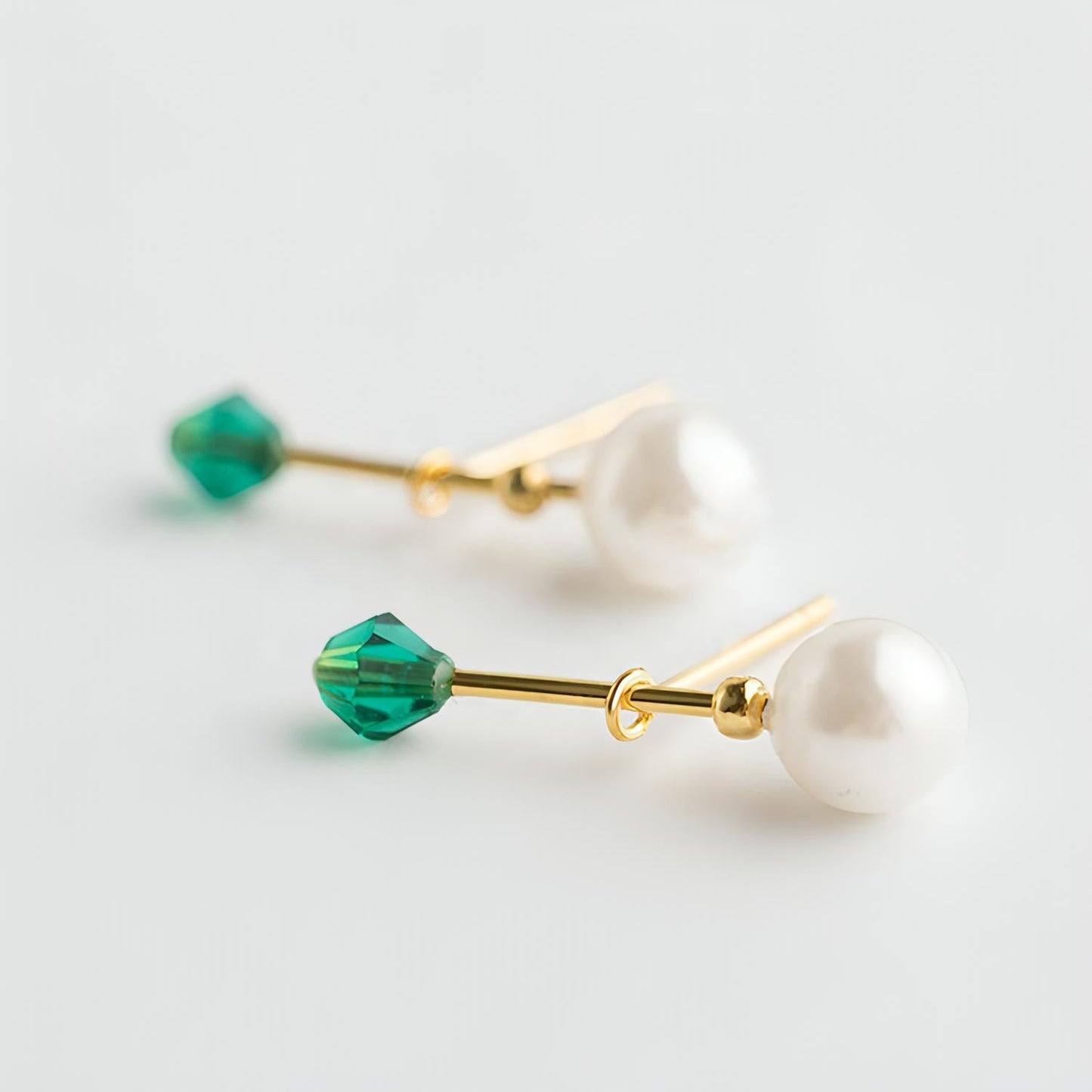 Pearl drop studs with green detail