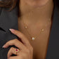 Ruby red gemstone with cubic zirconia halo and pave band on 18K gold vermeil paired with Saturn necklace with cubic zirconia centre in 18K gold vermeil.
